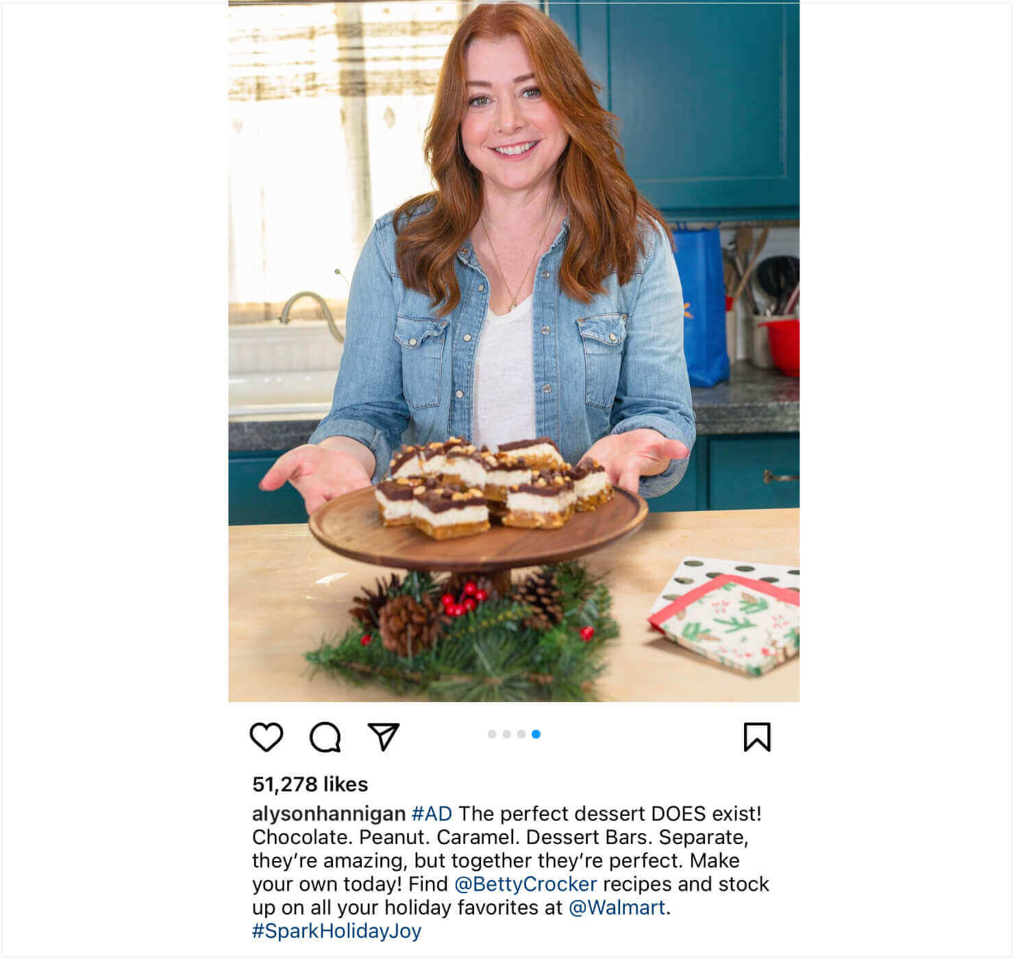 Instagram post from actress Alyson Hannigan. The photo shows her with a platter of a dessert. Text says: "alysonhannigan #AD The perfect dessert DOES exist! Chocolate. Peanut. Caramel. Dessert Bars. Separate, they're amazing, but together they're perfect. Make your own today! Find @BettyCrocker recipes and stock up on all your holiday favorites at @Walmart. #SparkHolidayJoy"